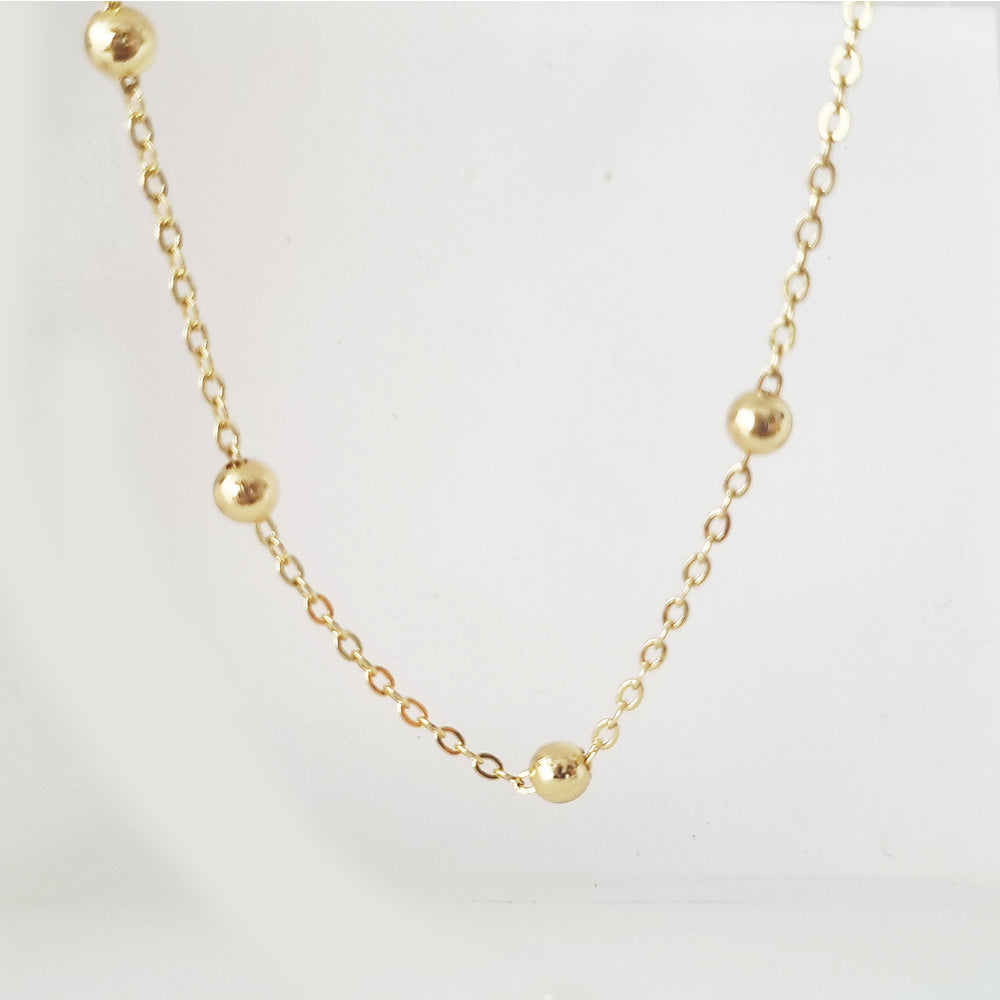 collar bolitas doradas