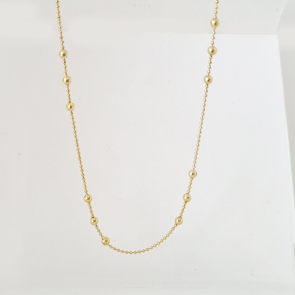 collar bolitas doradas