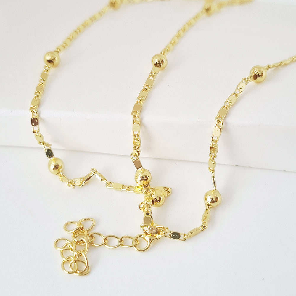 collar bolitas doradas